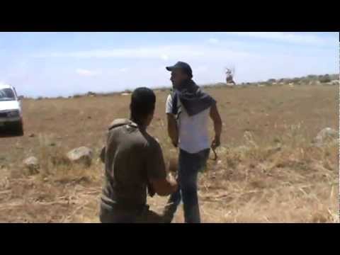 Settlers attacking Nasser Nawaj’a near Susiya and breaking his camera while soldiers stand by idly