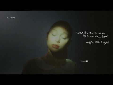 Ariana Grande singing the 'warm' song text in the music video.