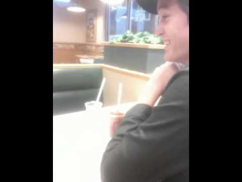 Shawn eating ketchup.