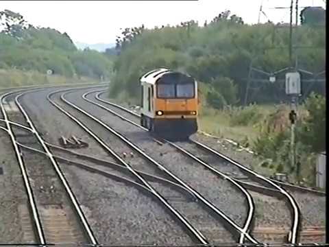 A class 60 arrives into Stormy Down Loop for a 158 Sprinter to pass by in 1990's.