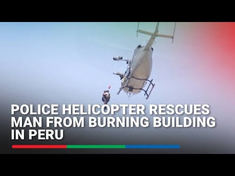Police helicopter rescues man from burning building in Peru
