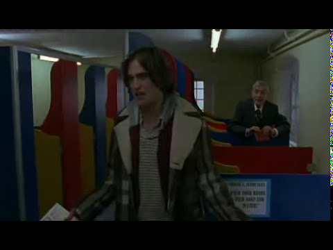 How to Be (2008) trailer still with Robert Pattinson as Art, guitar case in hand
