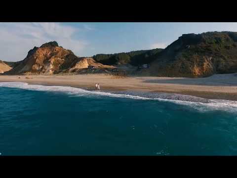 Gyan Chor : Drone Footage of Blue Ocean  and Waves On The Beach Kissing The Shore