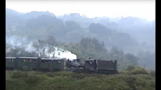 preview picture of video 'Chinese steam - Shibanxi passenger train on the Jaoba horseshoe curve (tender first)'