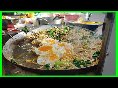 Asia street food on 2020 / Fried short noodle with omelette egg / (Lort Cha).