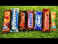 Opening Popular Chocolate Bars Satisfying Candy Unwrapping On Green Grass