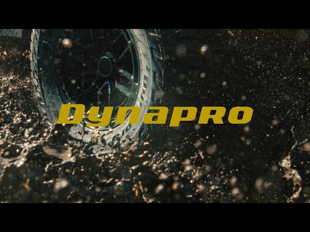 Truck tire spinning through mud and water spray in a Hankook Dynapro commercial