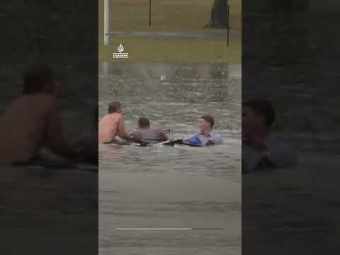 Australian TV reporter rescues man from sinking car