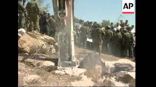 Israeli soldiers fire tear gas at protesters