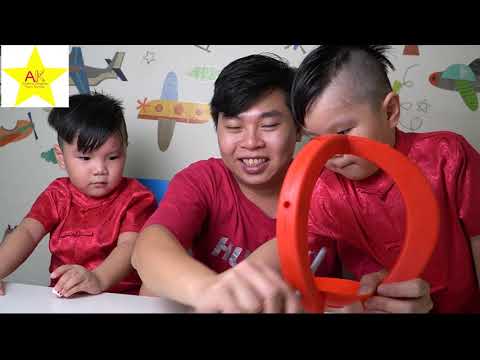 Aiden &  Kingsley play a new toy called 'Stick Game.'