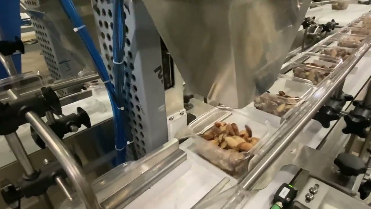 Clamshell filling and closing system