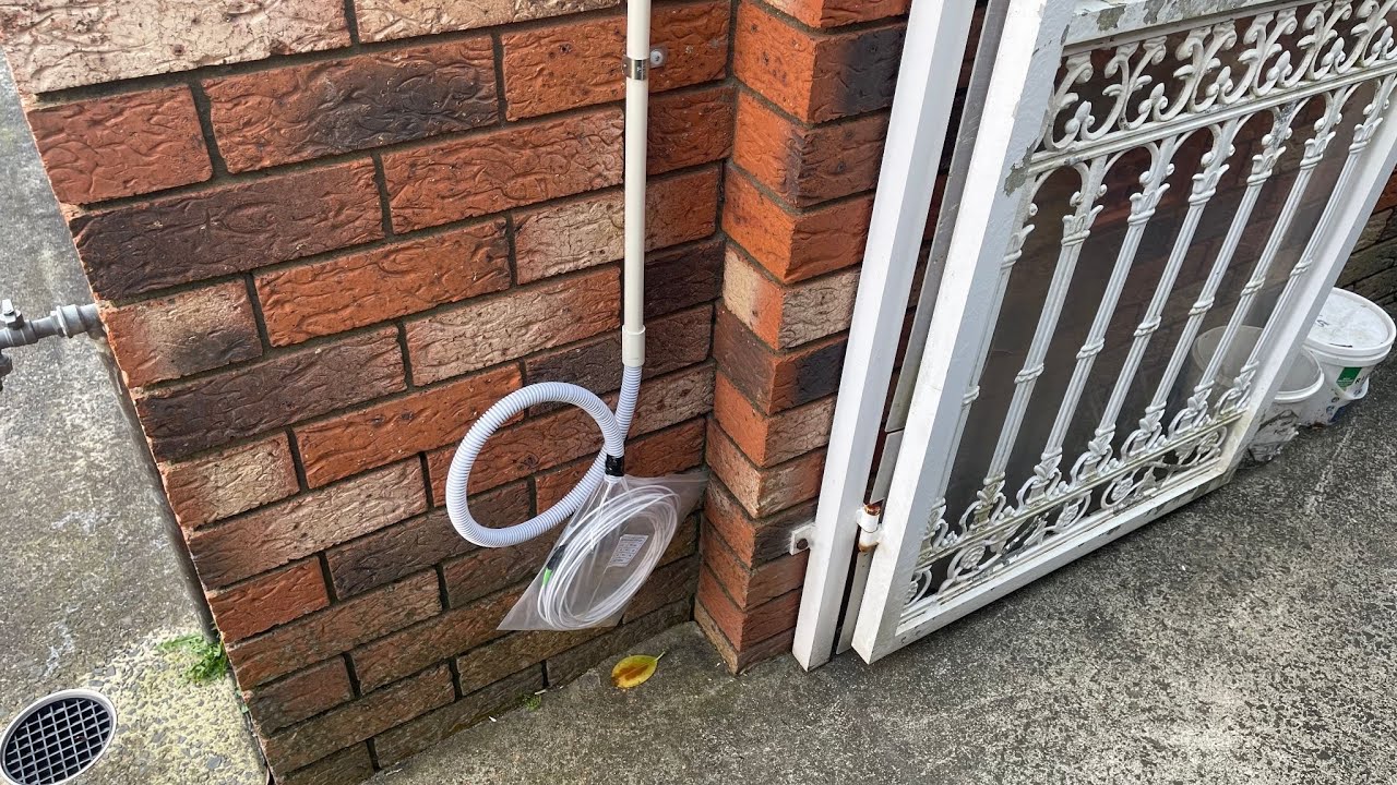 SECURE A COM technician hiding conduit along balcony eaves during NBN FTTP NTD pre-wire at Arncliffe Sydney — moving fibre entry point from garage to upstairs office