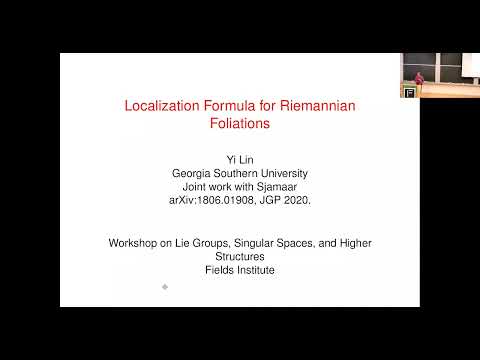 Localization formula for Lie algebra actions on Riemannian foliations