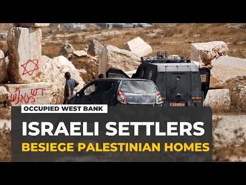 Israeli settlers besiege Palestinian homes in the occupied West Bank