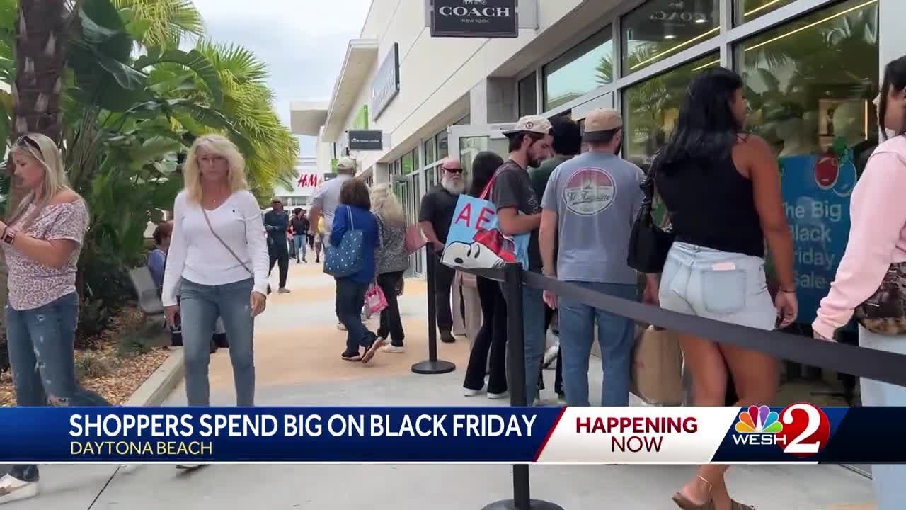 Shoppers fill bags, carts for Black Friday at Daytona Beach outlets
