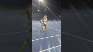Student working tennis top spin pro and billie jea