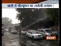 Fire services sprinkle water on trees near Delhi Secretariat due to rising air pollution