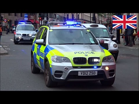 Armed police cars responding with bull horn & siren urgently x2