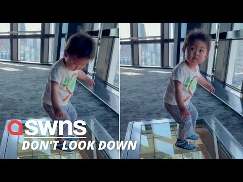 Hilarious moment a Japanese toddler reacts to a glass floor viewing platform of Tokyo streets | SWNS