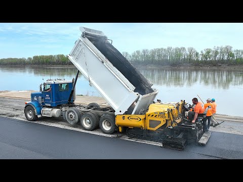 TRAINING DUMP TRUCK DRIVER HOW TO UNLOAD ASPHALT INTO PAVER