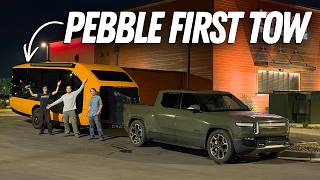 Pebble Flow electric trailer hitched to Rivian R1T on highway