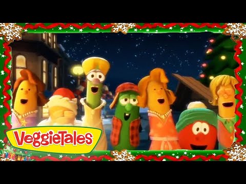 VeggieTales characters wearing festive outfits, singing together under a starry night with a holiday border frame.