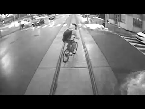 Close call: Cyclist crosses tracks in front of train