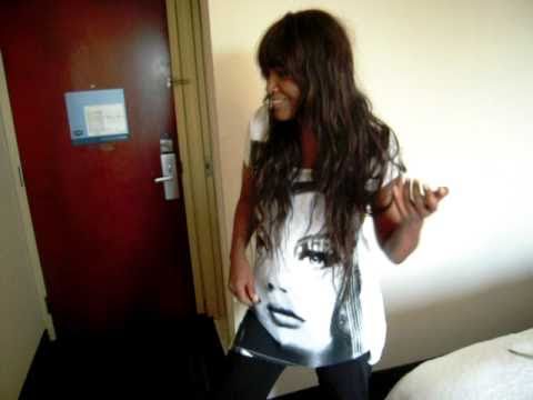 Eloisia (Nouvelle Vague) rocking on Guitar Hero's Air Guitar in a hotel room in NYC