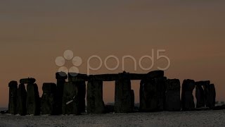 Time lapse Sunrise in winter over Stonehenge, Wiltshire England UK. Stock Footage