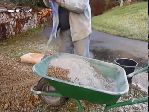 Mixing concrete by hand in a wheelbarrow the easy way
