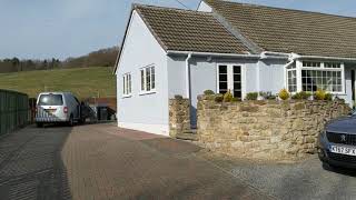 Album cover: Mouse grey silicone render with brick effect band 