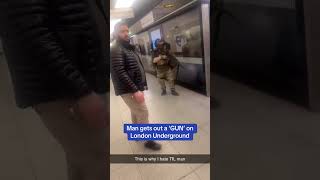 Shocking moment a man gets out a 'GUN' on London Underground
