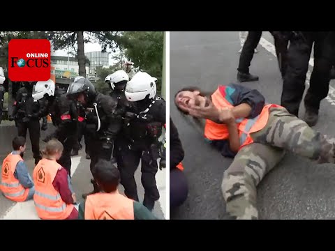 Pariser Polizei reißt festgeklebte Klima-Aktivisten von der Straße