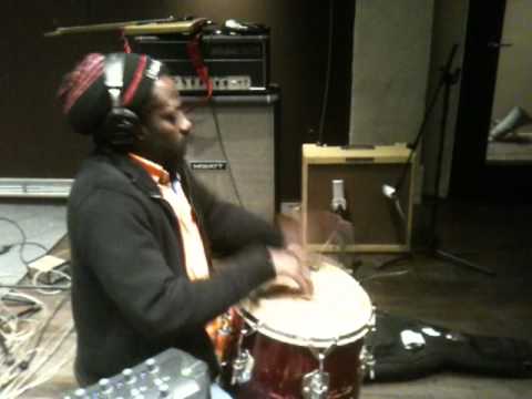 Kologbo playing percussions