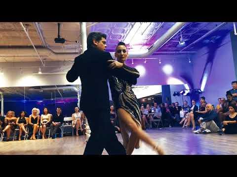  Alejandra Hobert  and  Adrian Veredice  are  dancing  at  Windy City Tango Festival  in  2019