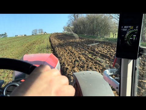Massey Ferguson 8S.265 ploughing and 6718S discing same field, in cab view