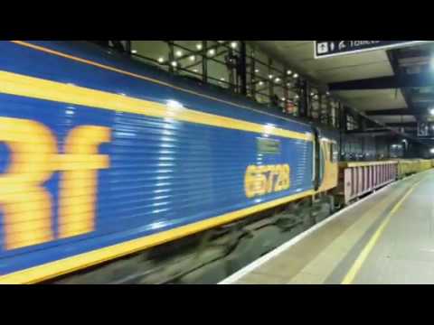 Gb class 66728 through Ashford platform 1 on the 10/6/17.