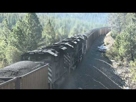 130-car coal train w/ double helpers crosses Greenhorn Trestle, Mullan Pass MT.