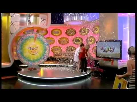 Woman Falls Down on Stage After Winning Lotto Spin
