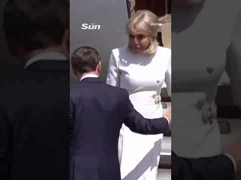 Moment Brigitte Macron 'rejects' husband's help leaving plane after viral slap vid
