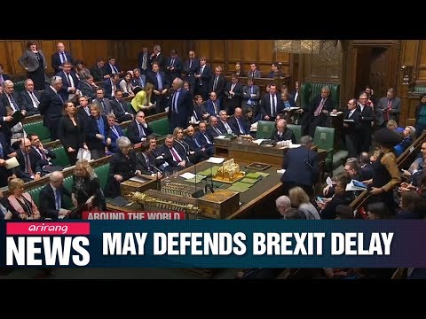 Theresa May defends Brexit delay amid calls for resignation