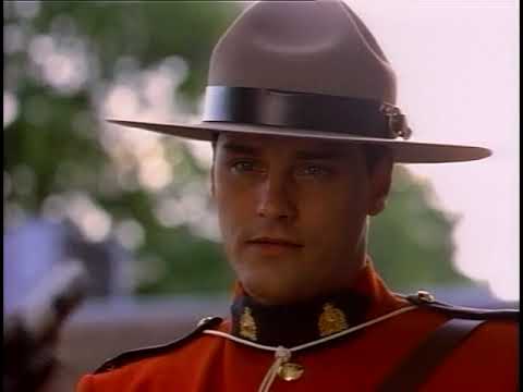 Due South season-one trailer still: Benton Fraser and Ray Vecchio framed by Chicago skyline