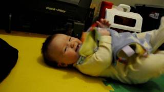 Rolling over, baby Elspeth