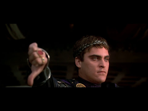 Trailer frame: Maximus in armor in the arena tunnel as drums start to roll