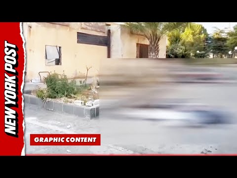 Bodybags lay across the floor outside of Syrian hospital