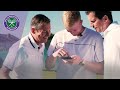 Kyle Edmund and Tim Henman test their serves on the Jaguar Ace Pace app at Wimbledon