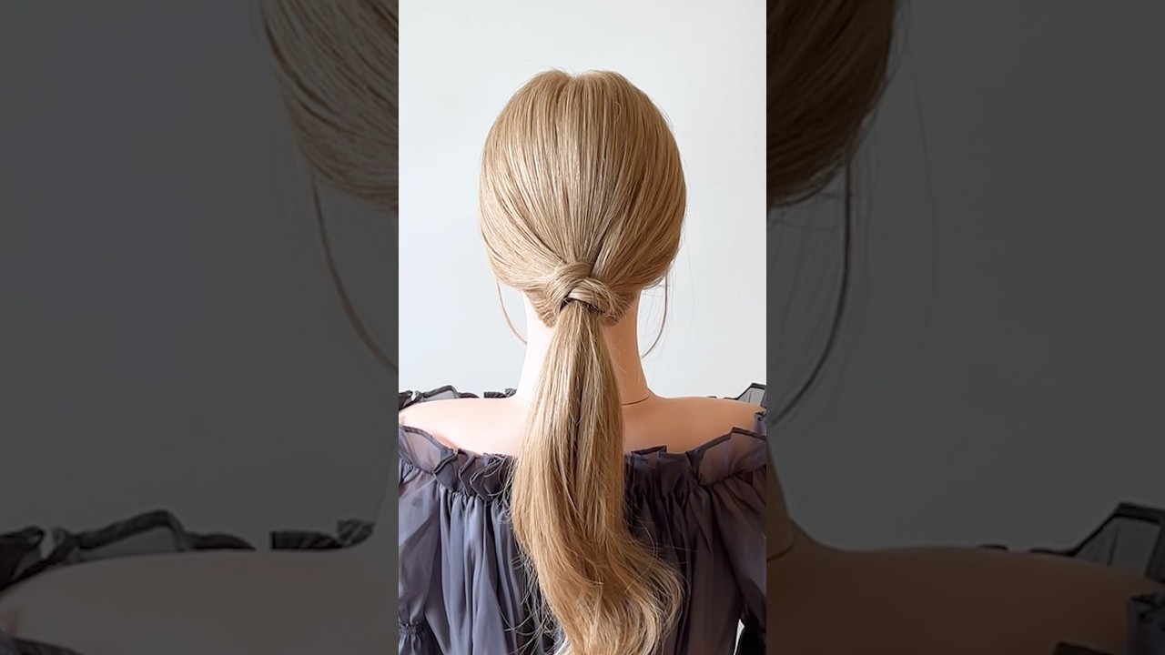 左の髪を右へ通すズマ