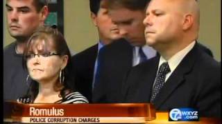 Romulus officers charged