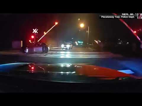 NJ Police Save Driver On Tracks
