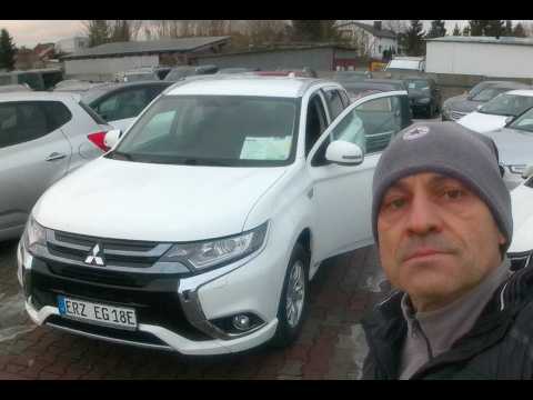 MITSUBISHI OUTLANDER LIKE NEW. HYBRID 4X4. RICH OPTIONS. LOOKING AT THE DEALERSHIP. PRICE. YEAR C...